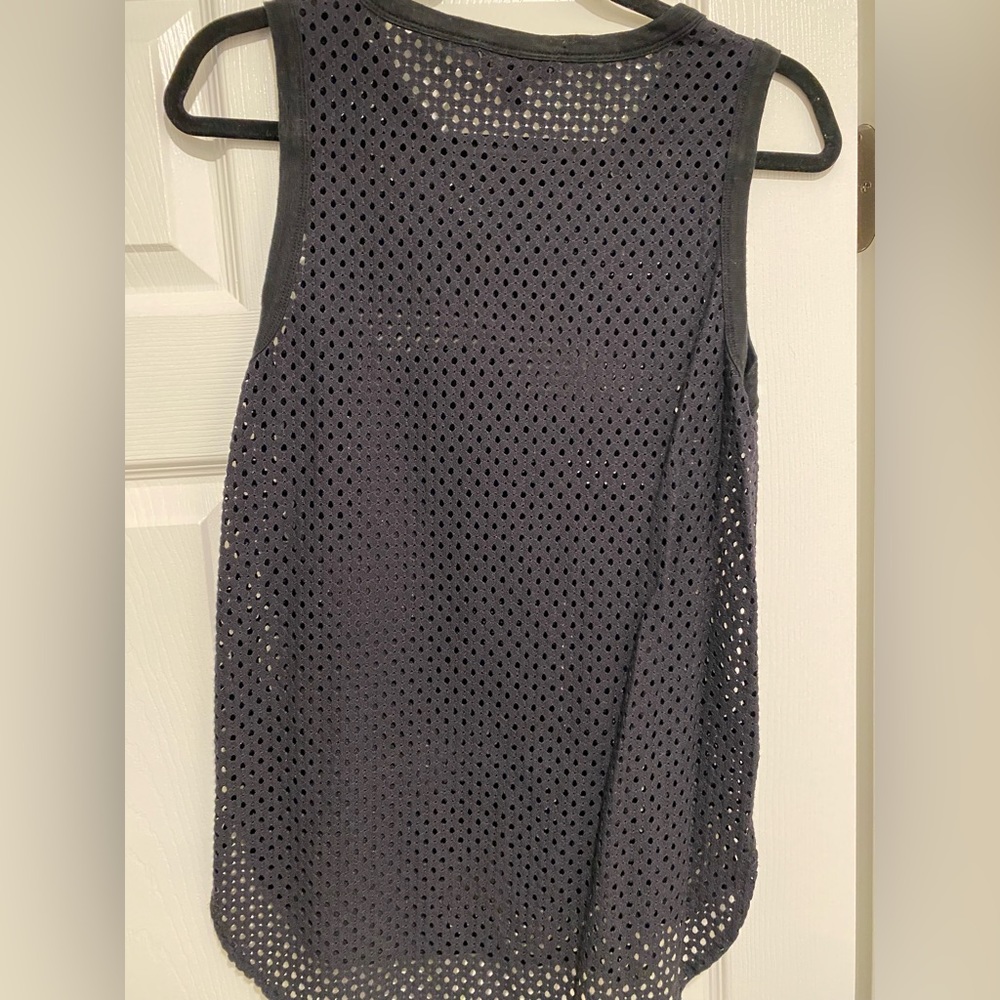 Black mesh-like tank.